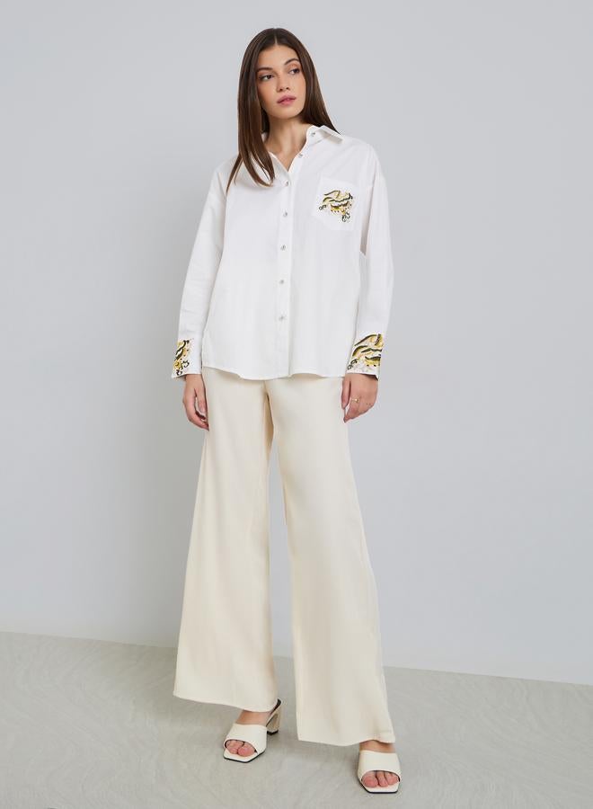 ستايلي بلوزة واسعة بتفاصيل مُطرّزة مع أكمام بأساور - Image 2